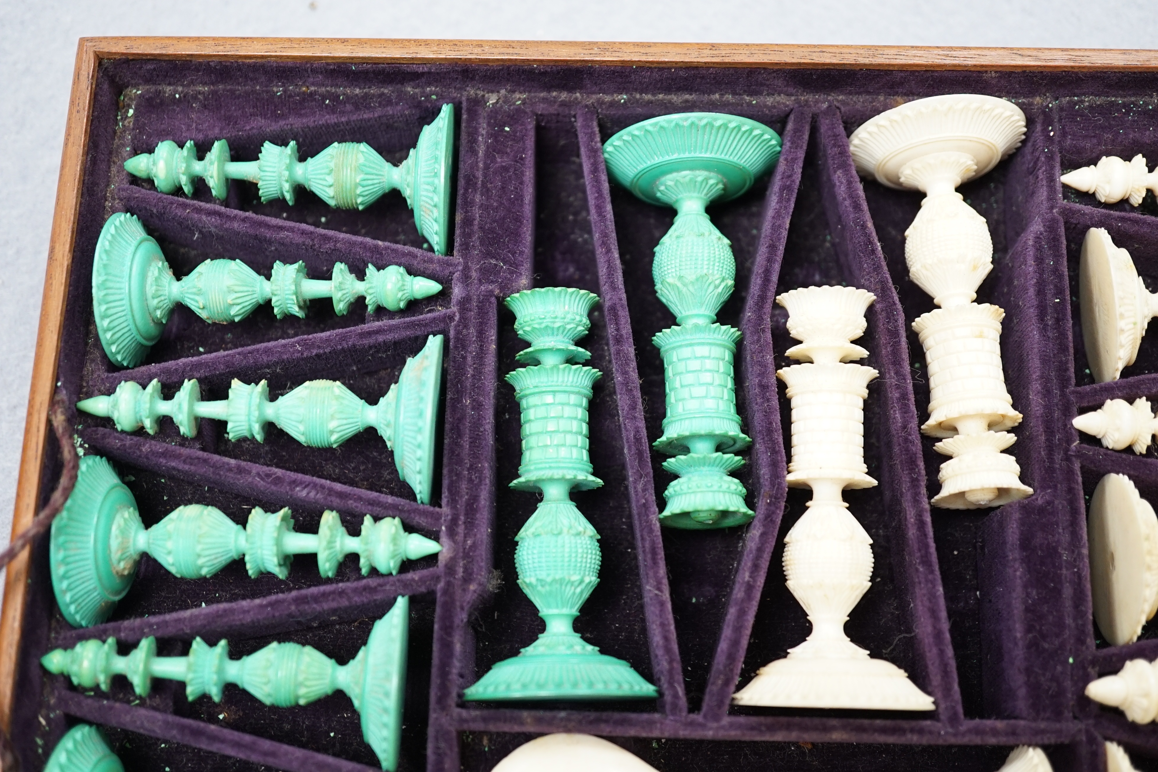 A boxed 19th century Burmese pattern ivory chess set, one pawn restored, king height 11cm